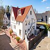 Loxstedt - Lichtdurchflutete 3-Zimmer-Maisonettewohnung im Ortszentrum - Rückansicht - (KI generiert)