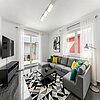 Loxstedt - Modernes KfW-60-Einfamilienhaus mit Erdwärme, Garage und pflegeleichtem Grundstück - Wohnzimmer - (KI generiert)
